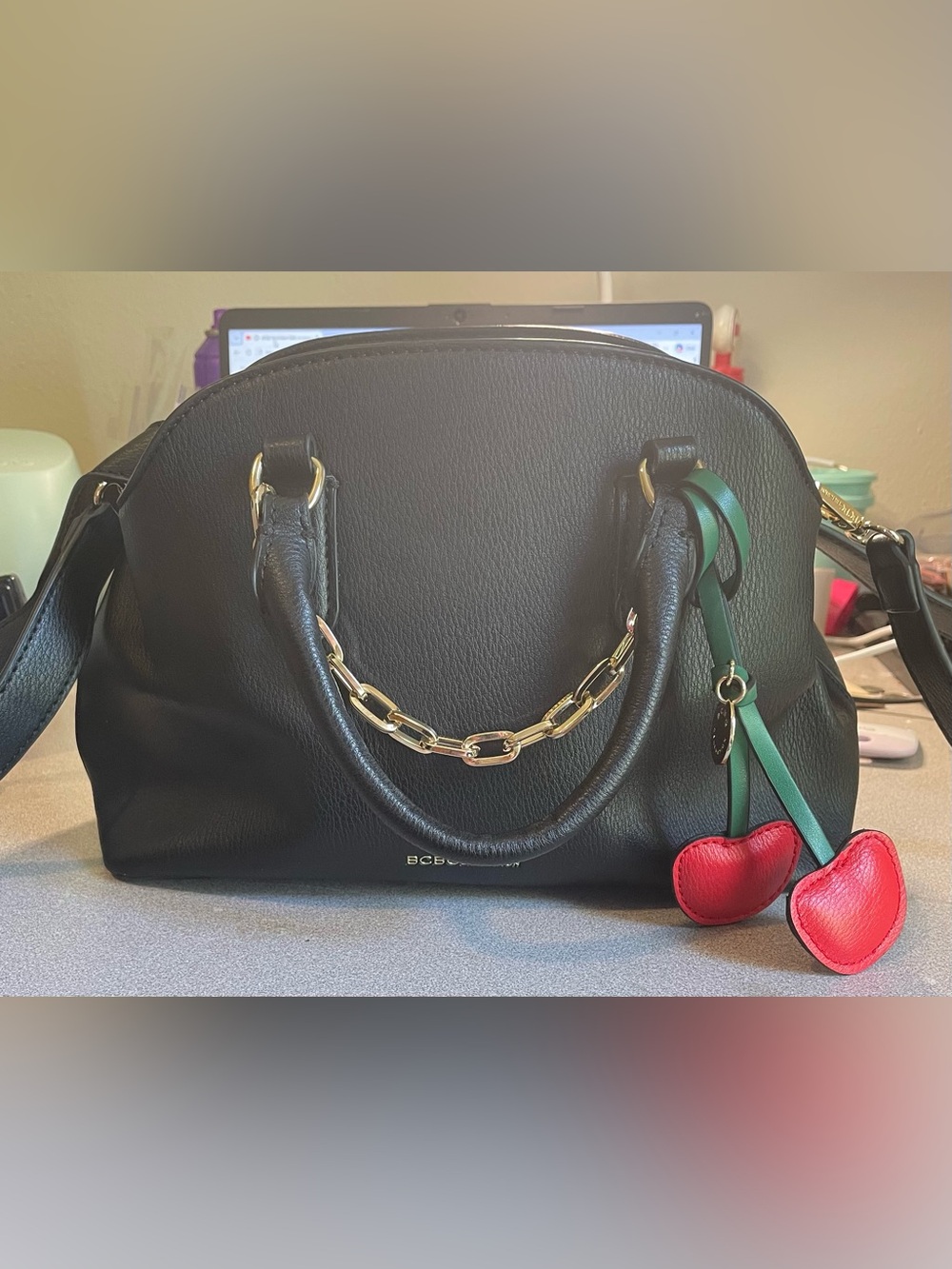 BCBG Black Leather Satchel with Gold Chain and Red Charm